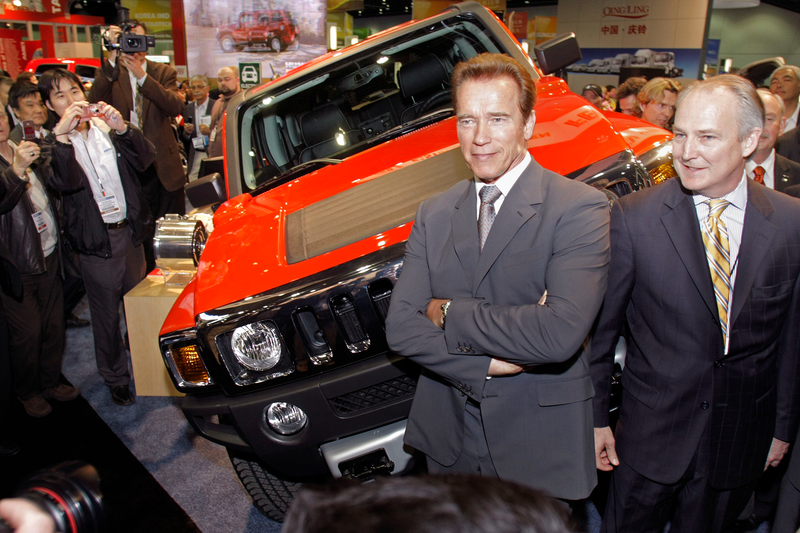 DETROIT, MI - APRIL 20: California Governor Arnold Schwarzenegger (L) and Raser Technologies Chairman Kraig Higginson pose with the new Hummer H3, the first full electric drive SUV, at the Society of Automotive Engineers World Congress April 20, 2009 in Detroit, Michigan. The H3 is a full-size, extended range plug-in hybrid electric Hummer SUV that can reportedly get more than 100 mpg in typical local driving over time. The H3 has a range of 40 miles on the battery charge before the combustion generator begins to use fuel, meaning many drivers would not use fuel on their daily commute. (Photo by Bill Pugliano/Getty Images)